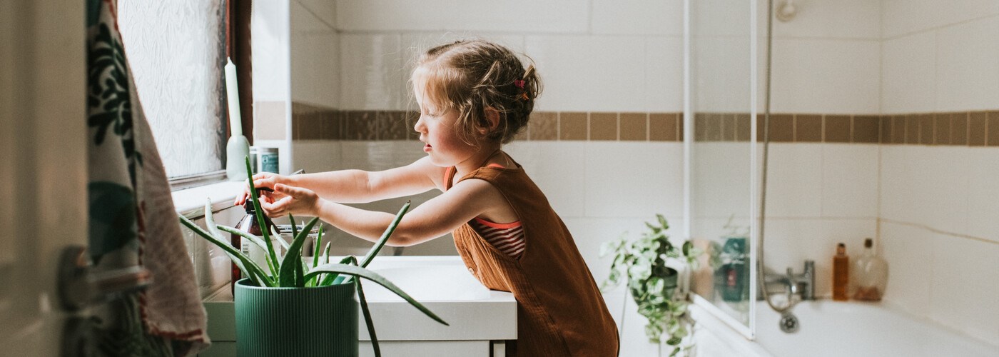 Little girl washing her hands