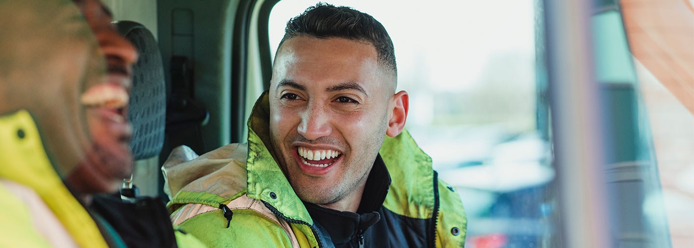 Workmen in van laughing 