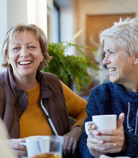 group of women chatting and smiling