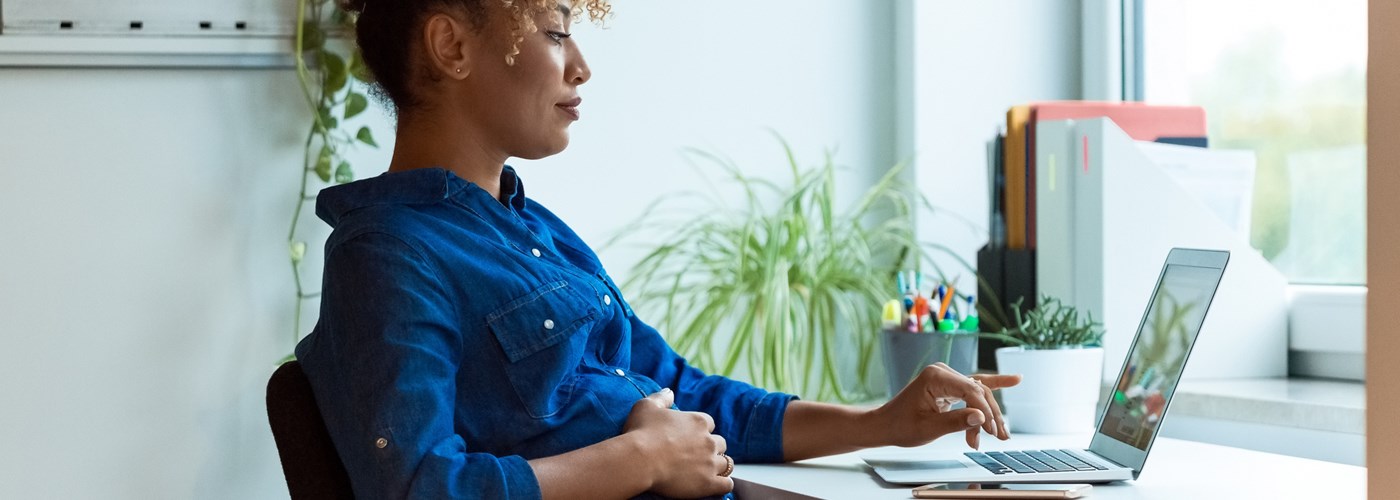 Pregnant person at work, soon to go on maternity leave