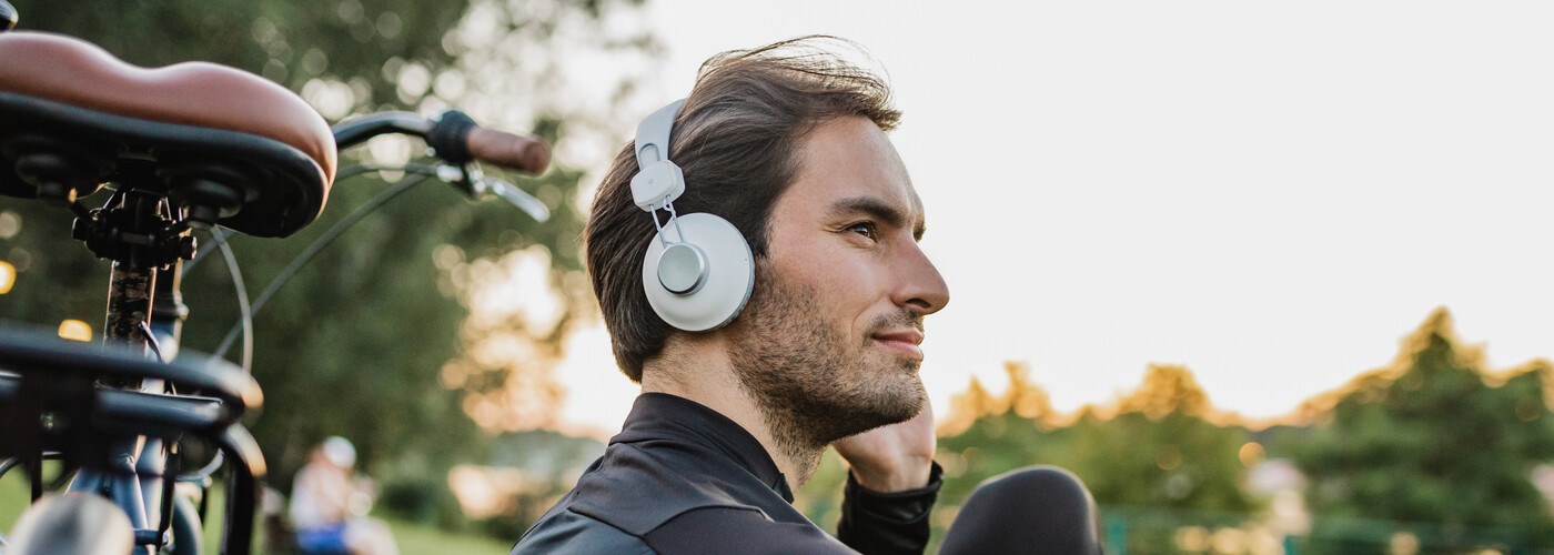 Man sat outside with his bike