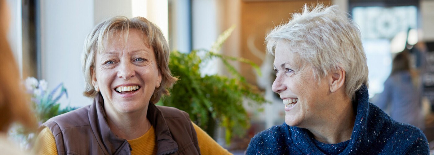group of women chatting and smiling
