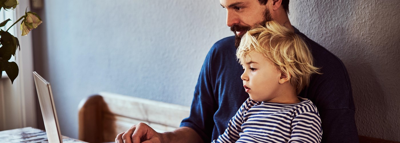 Man_working_instead_of_spending_time_with_his_young_child