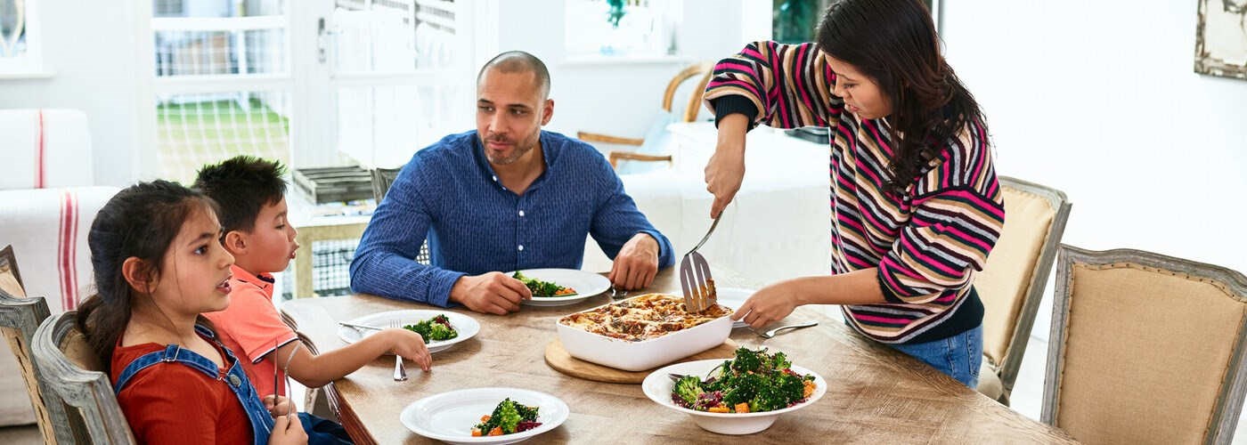 A family are sitting down for a healthy, balanced meal