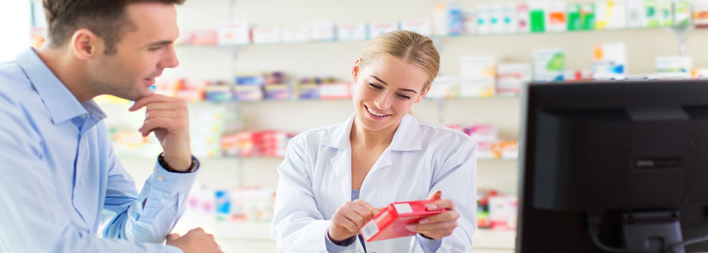 Pharmacist advising patient